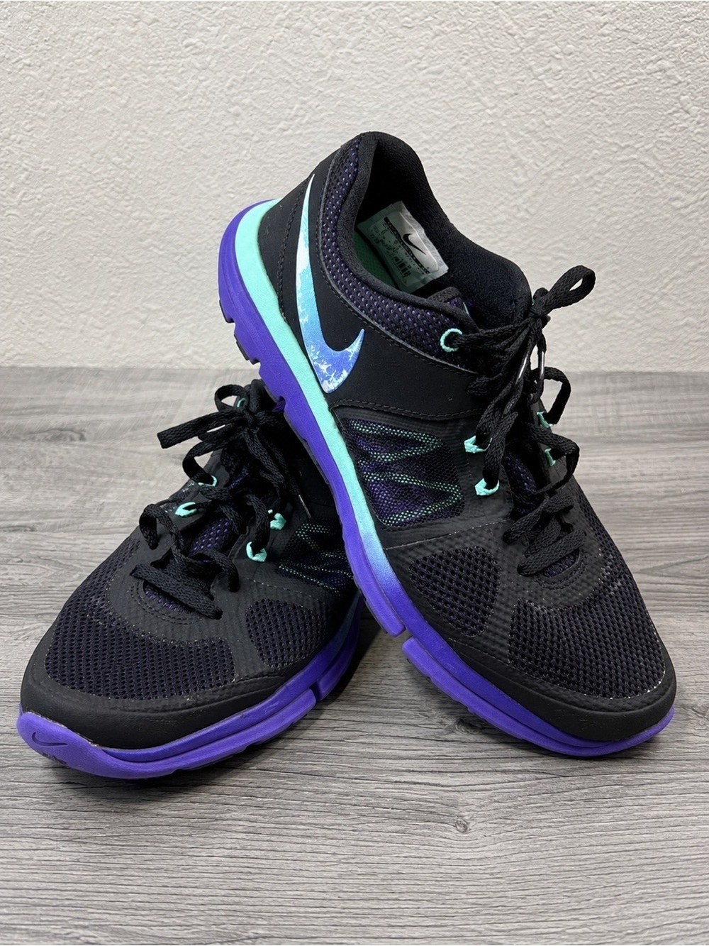 Nike Women’s Black Running Shoes with Purple Sole & Teal Accents